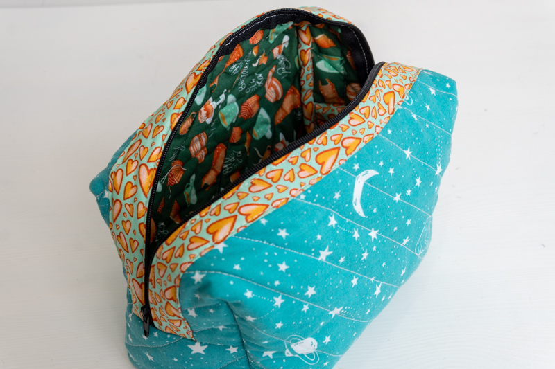 A quilted make up in space print polycotton with a cotton lining